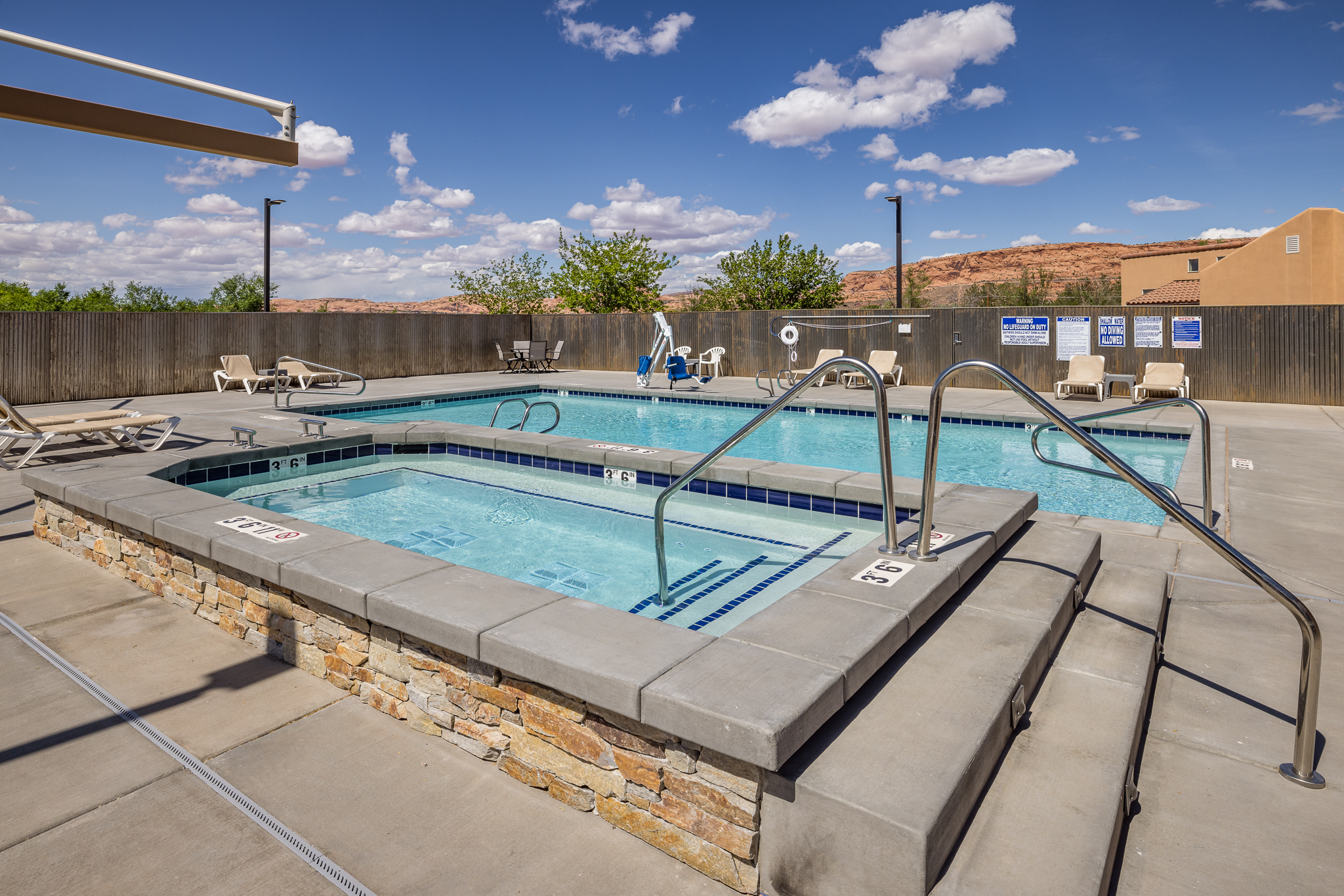 community pool and hot tub area. Pool open seasonally