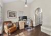 Off to the side of the living room is an office space for remote workers. 