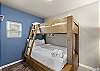 Guest bedroom with a twin-over-full bunk bed. 