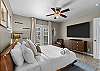 Unwind in this spacious king bedroom with a Smart TV and en suite bathroom.