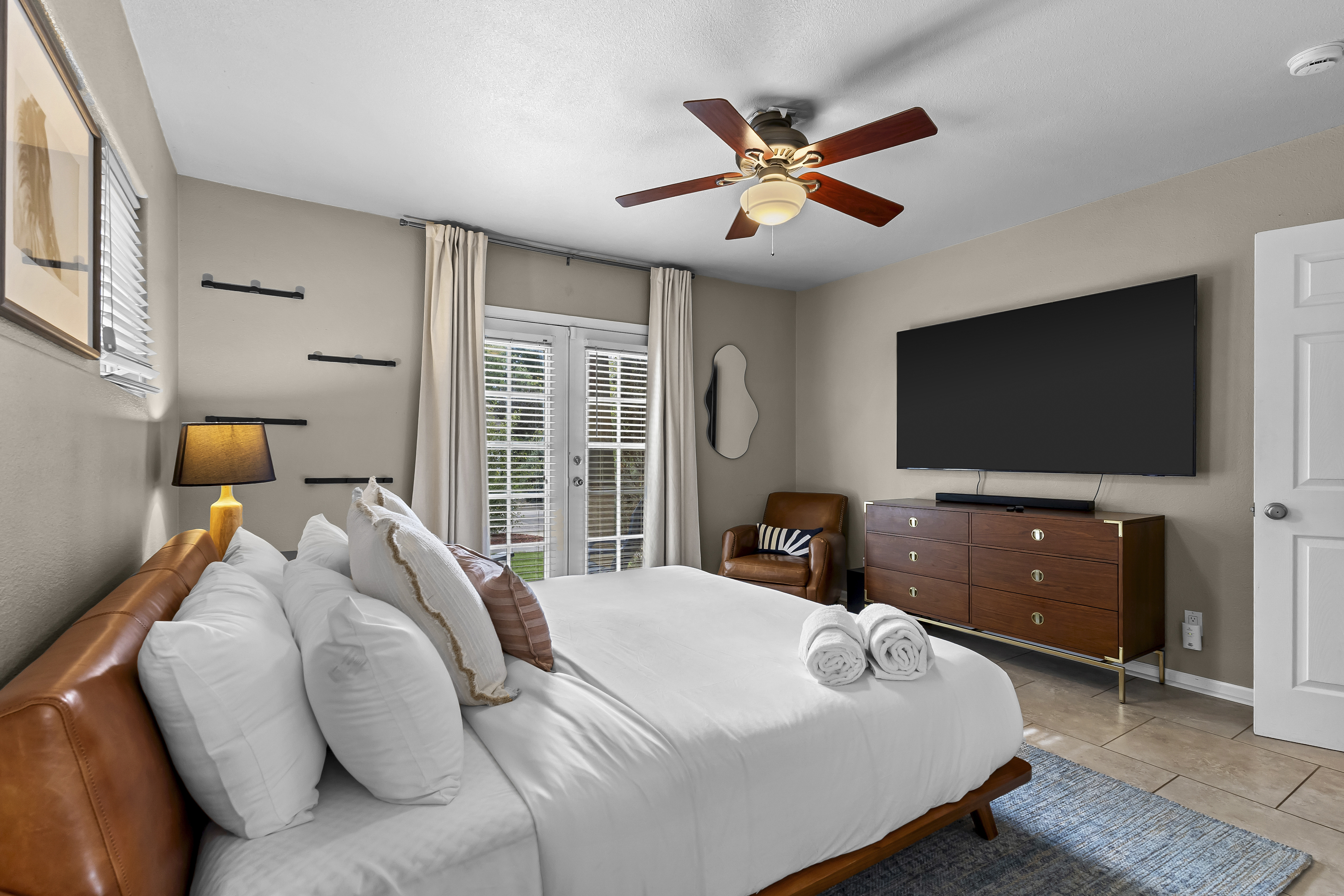 Unwind in this spacious king bedroom with a Smart TV and en suite bathroom.