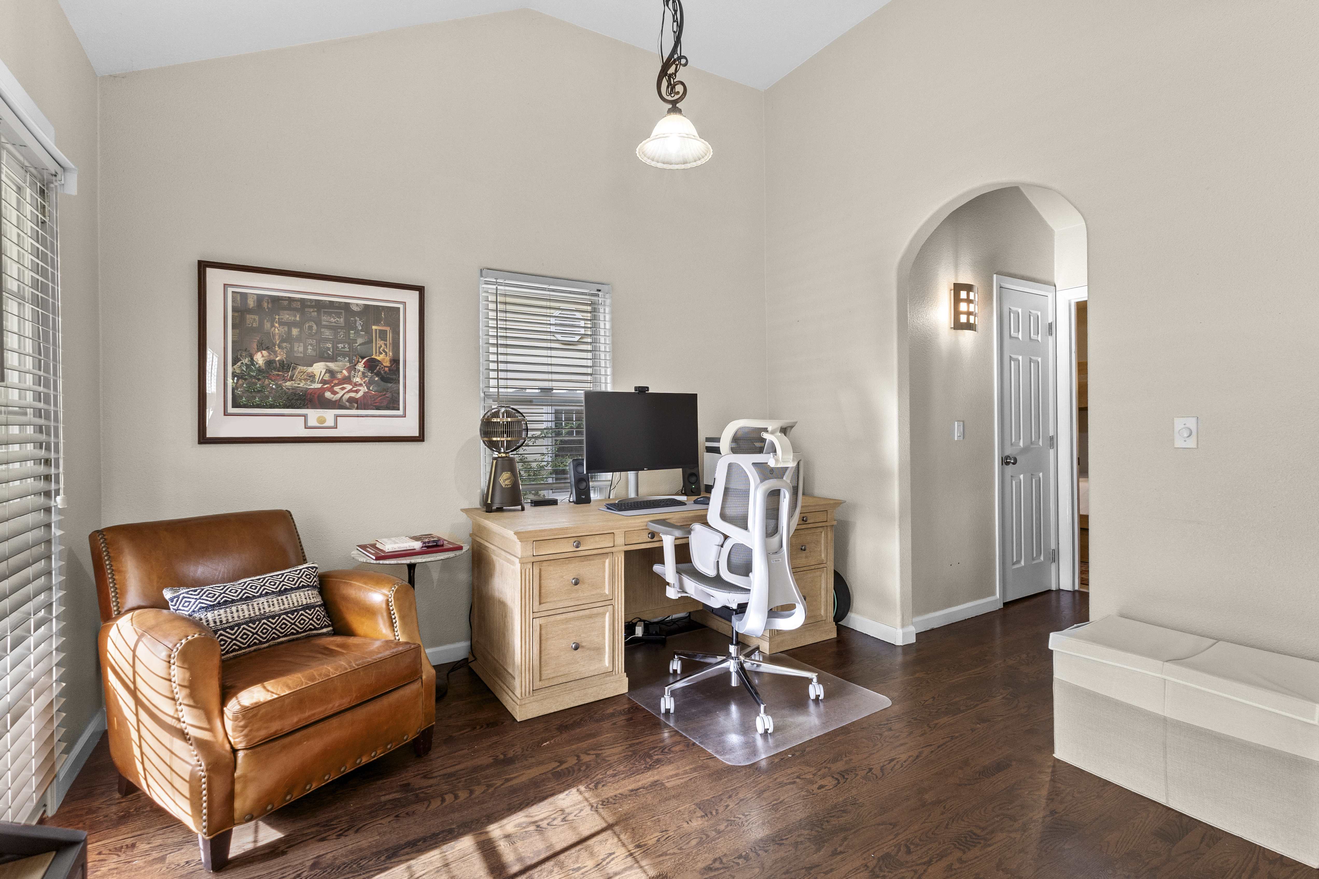 Off to the side of the living room is an office space for remote workers. 