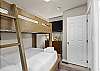 Guest bedroom with a twin-over-full bunk bed. 