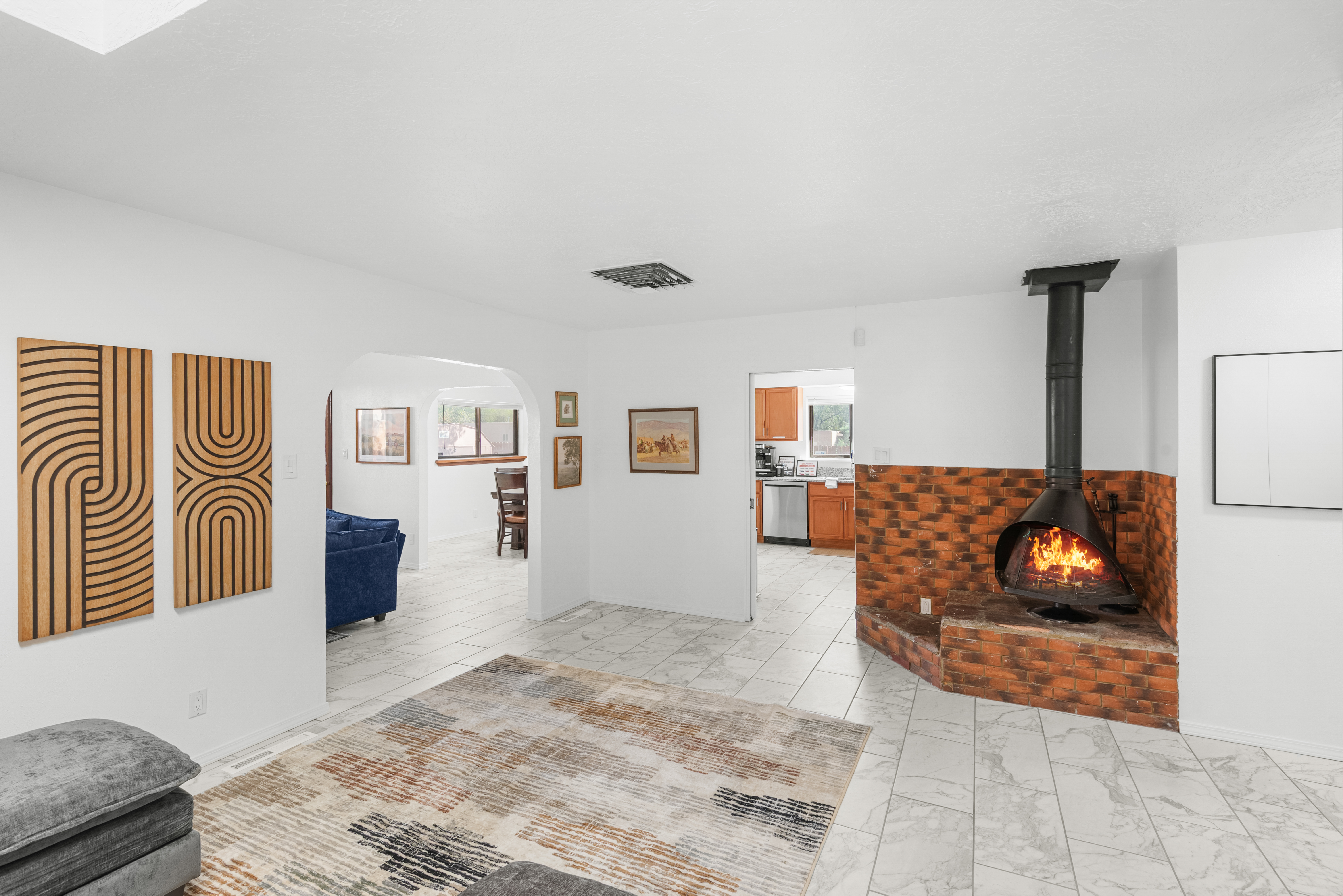Second living room space with a wood stove. 