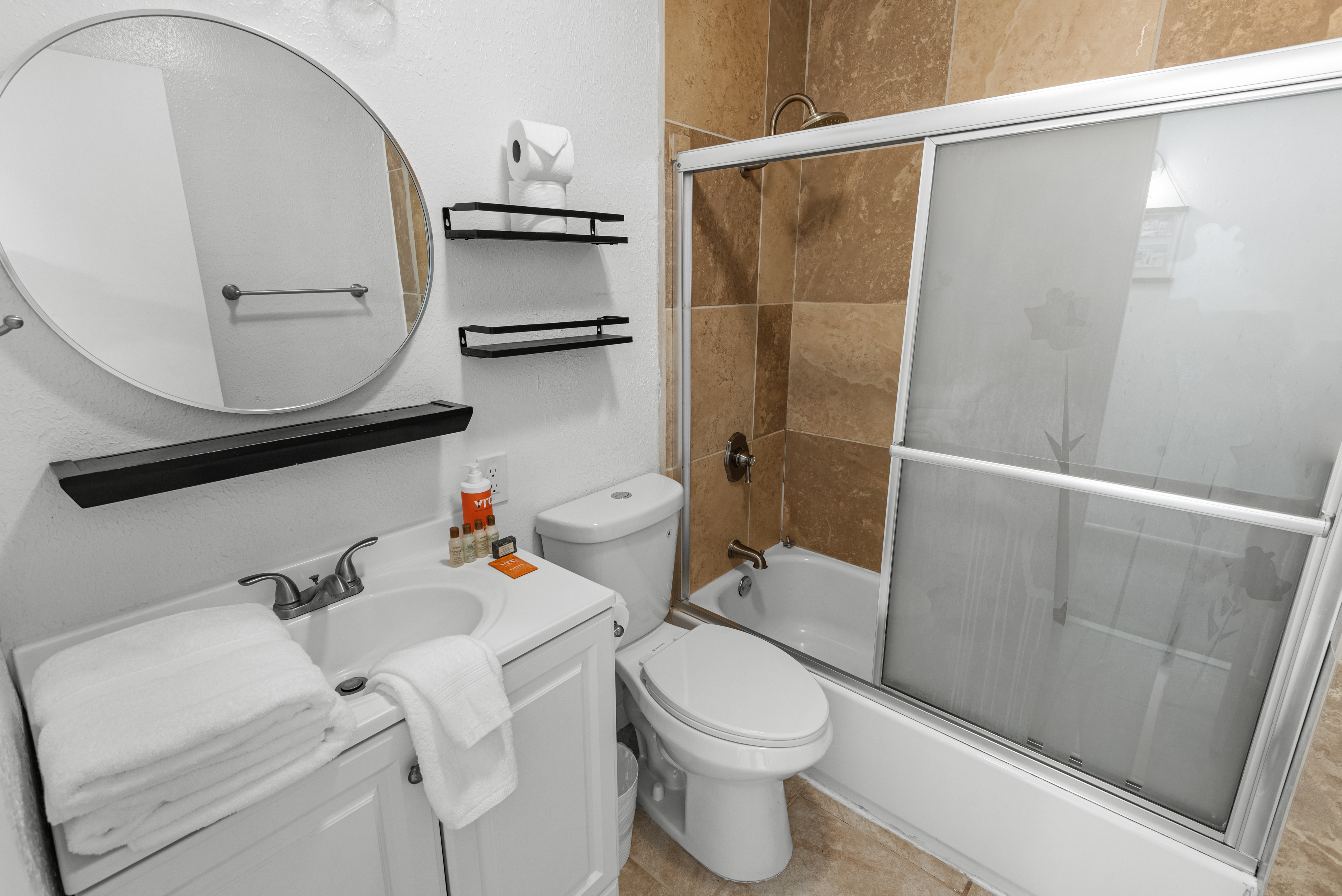 Guest bathroom with convenient tub/shower combo.