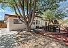 A fully fenced backyard with outdoor seating, a grill, hot tub, cornhole, and a basketball hoop! Plenty of space for your crew and your pets to roam.