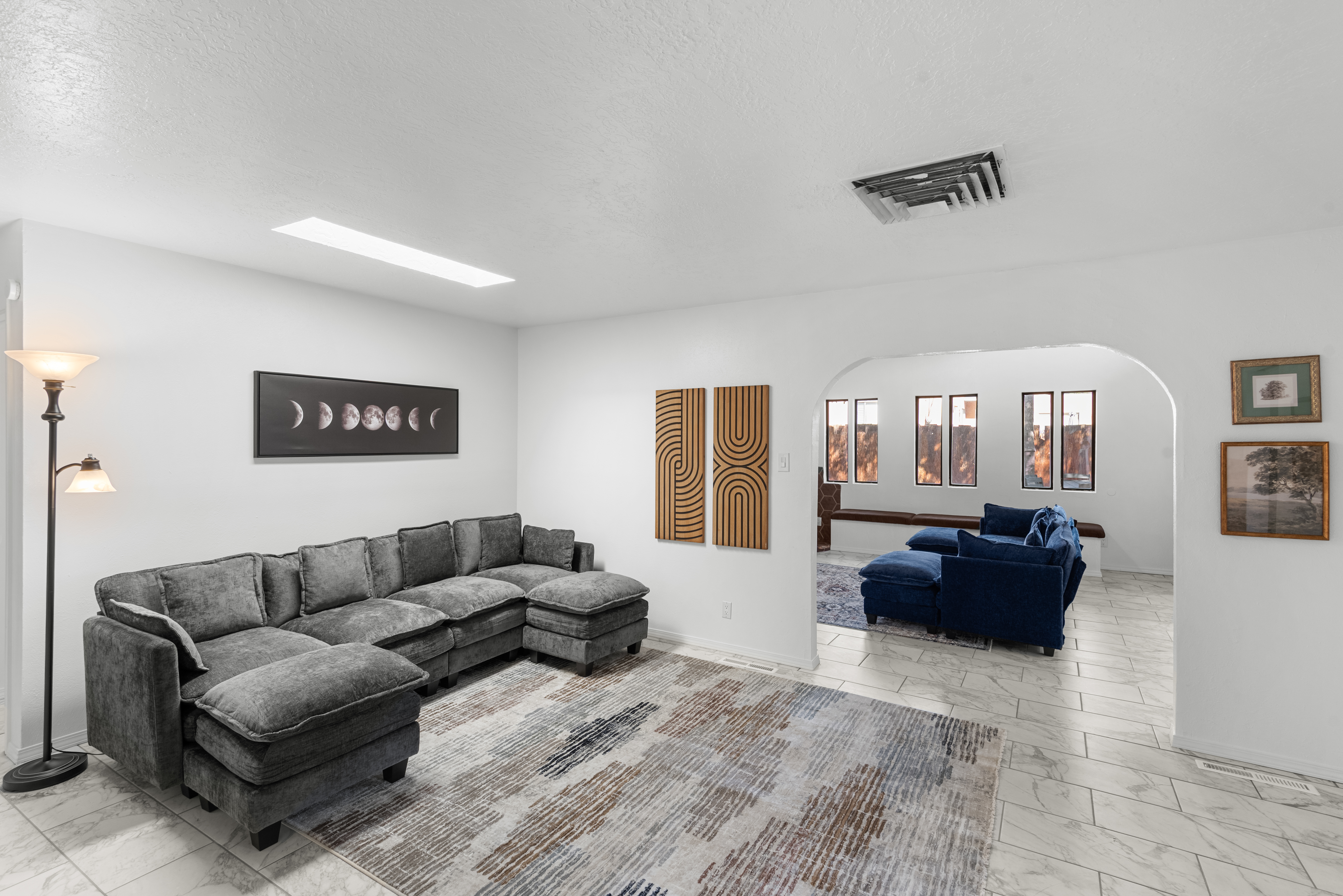 Second living room space with a wood stove. 