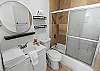 Guest bathroom with convenient tub/shower combo.