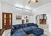 Spacious and inviting living room with a Smart TV, games, and a wood stove. The perfect spot to unwind after a day of adventure!