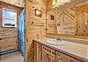 Main level bathroom with spacious vanity and tub/shower combo. 