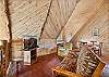 Our open loft offers comfort and relaxation with a futon, Smart TV and lots of books.