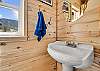 Main level half bathroom with a mountain view. 