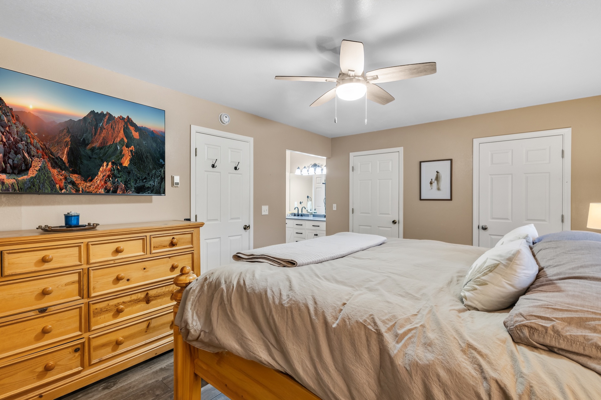 Our main level master suite offers a king bed, Smart TV and en-suite bathroom. 