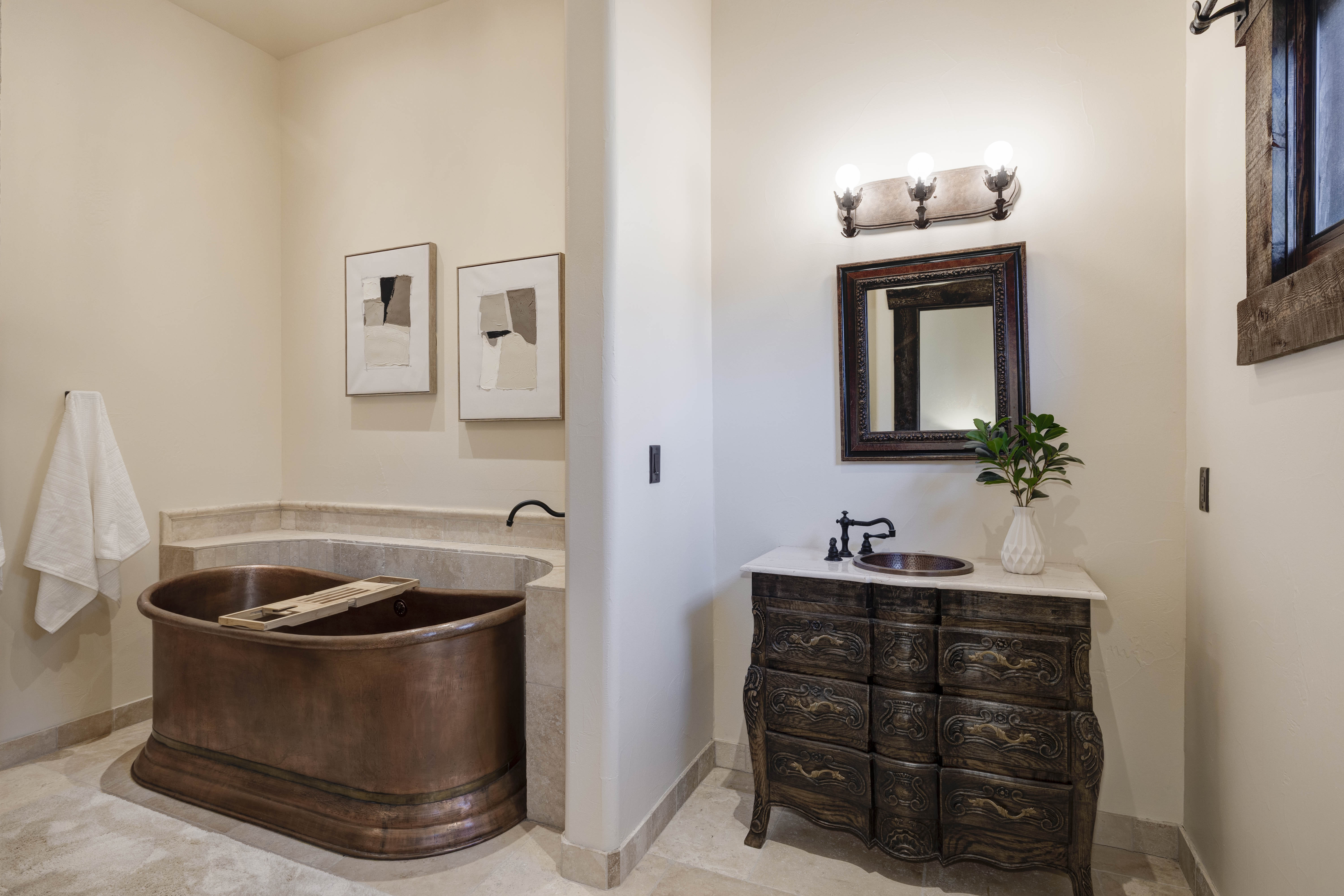 En suite bathroom with a copper tub and walk-in shower.