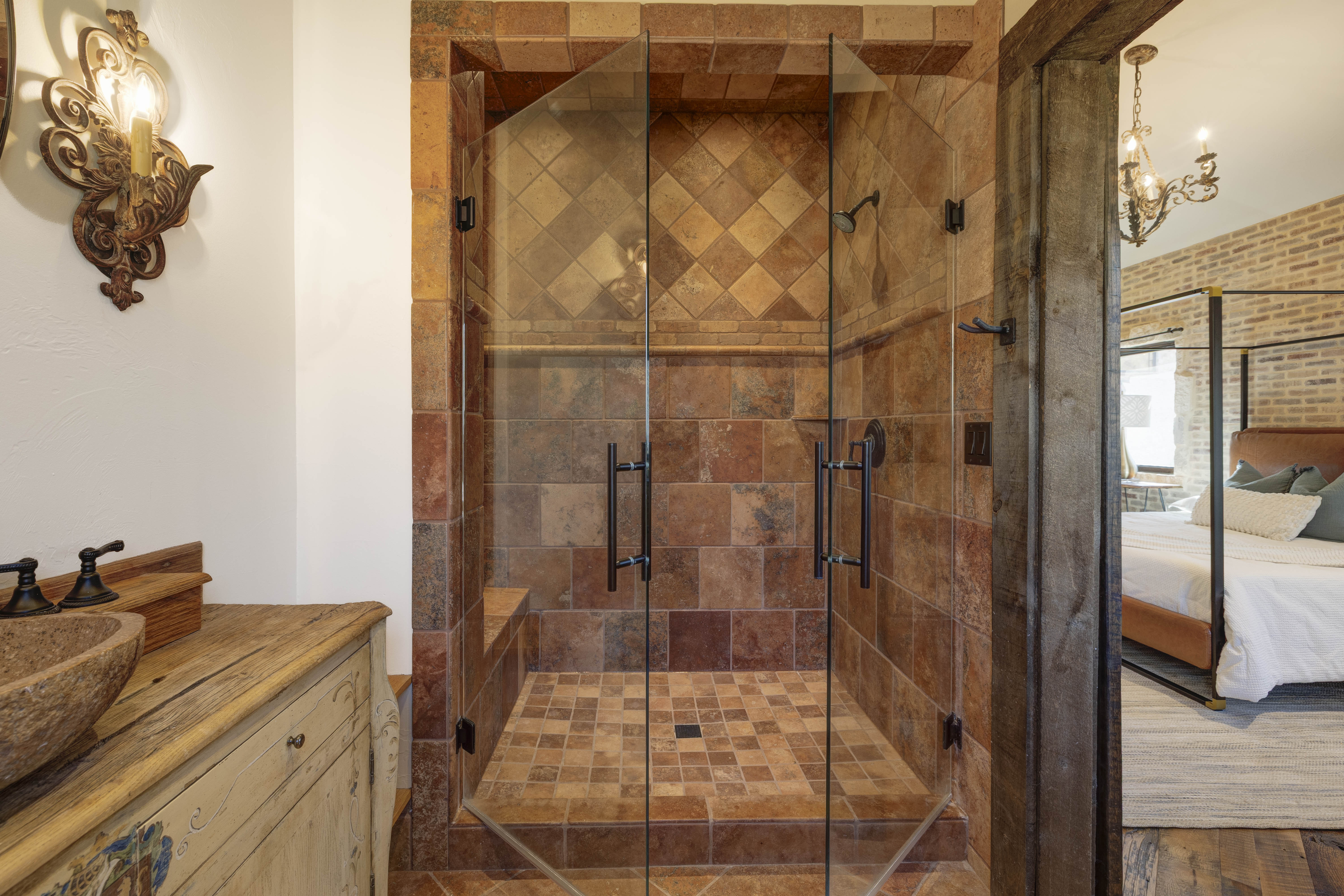 En suite bathroom featuring a sleek walk-in shower.