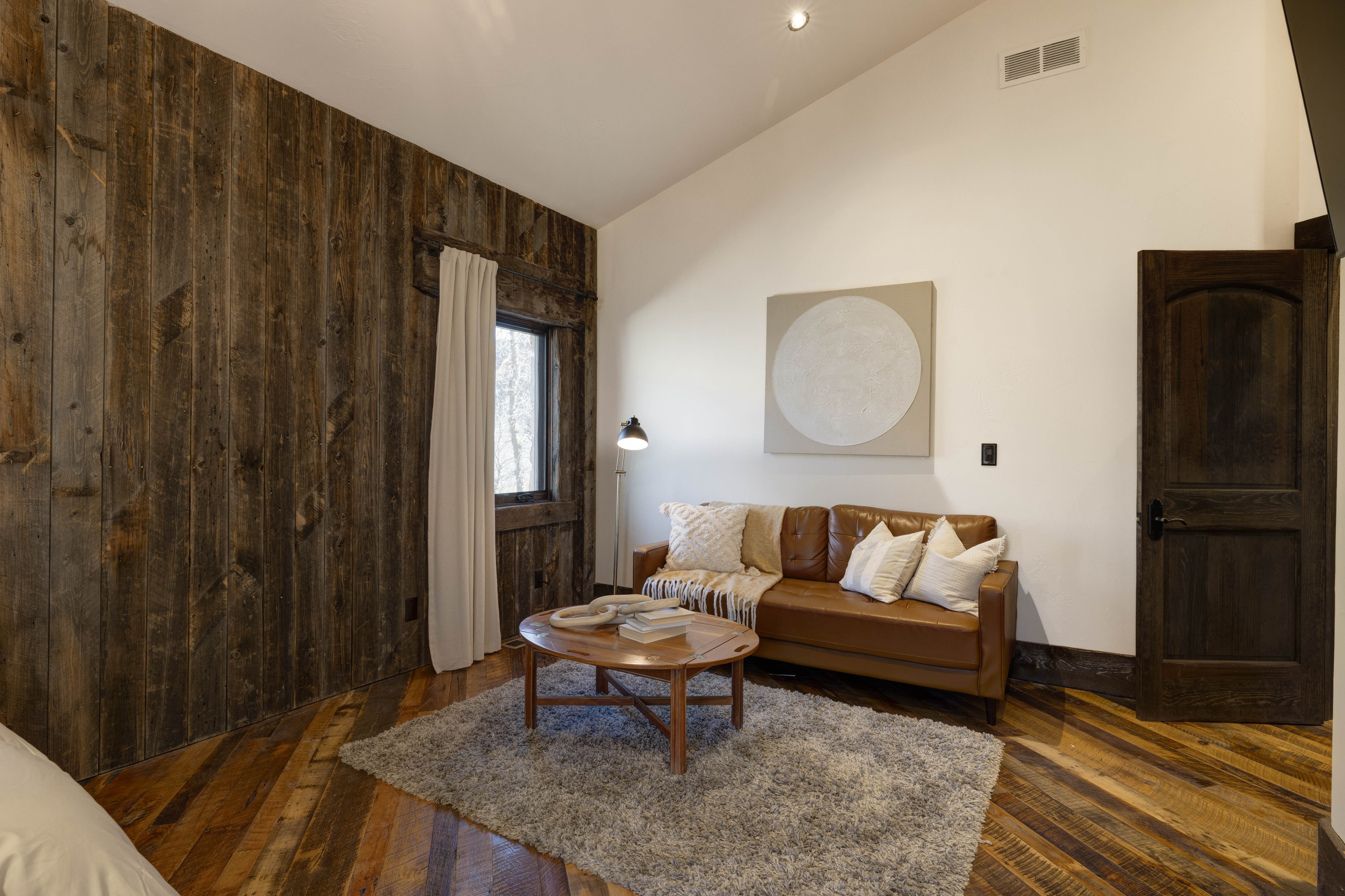 Queen bedroom #4 with a lounge area and its own en suite bath.