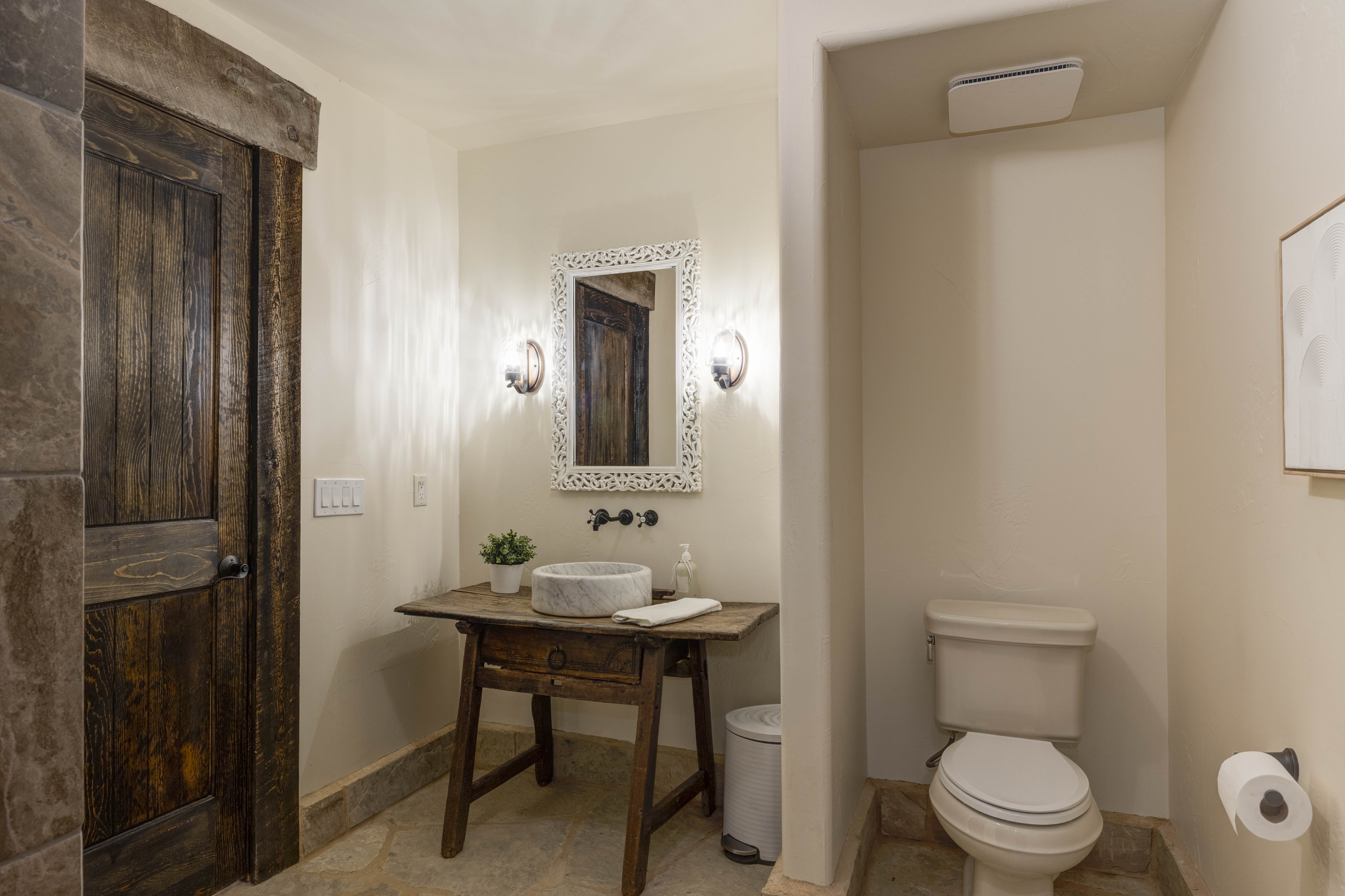 Seventh full bathroom located in the downstairs area.