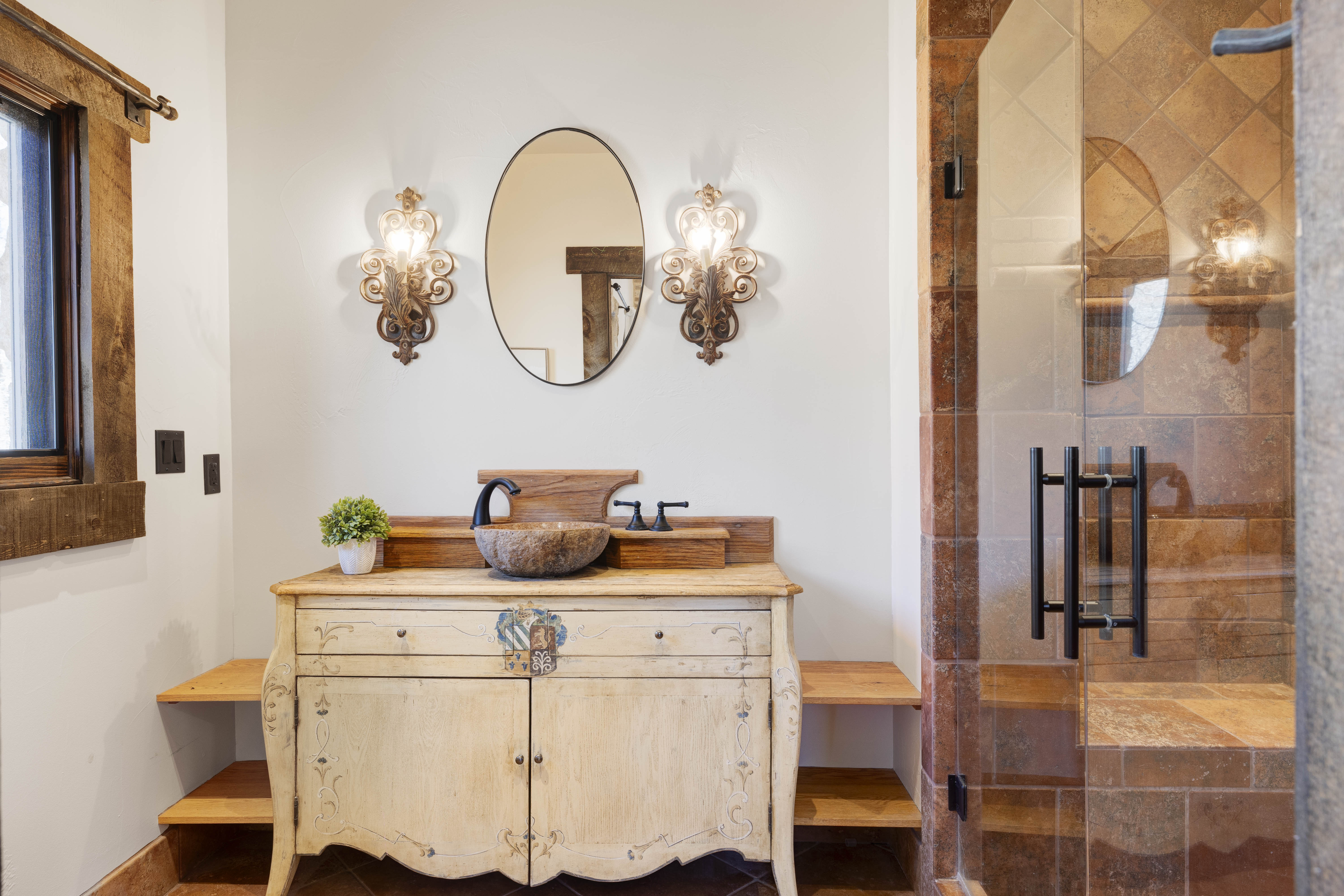 En suite bathroom featuring a sleek walk-in shower.