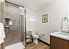 Full bathroom featuring a sleek walk-in shower.