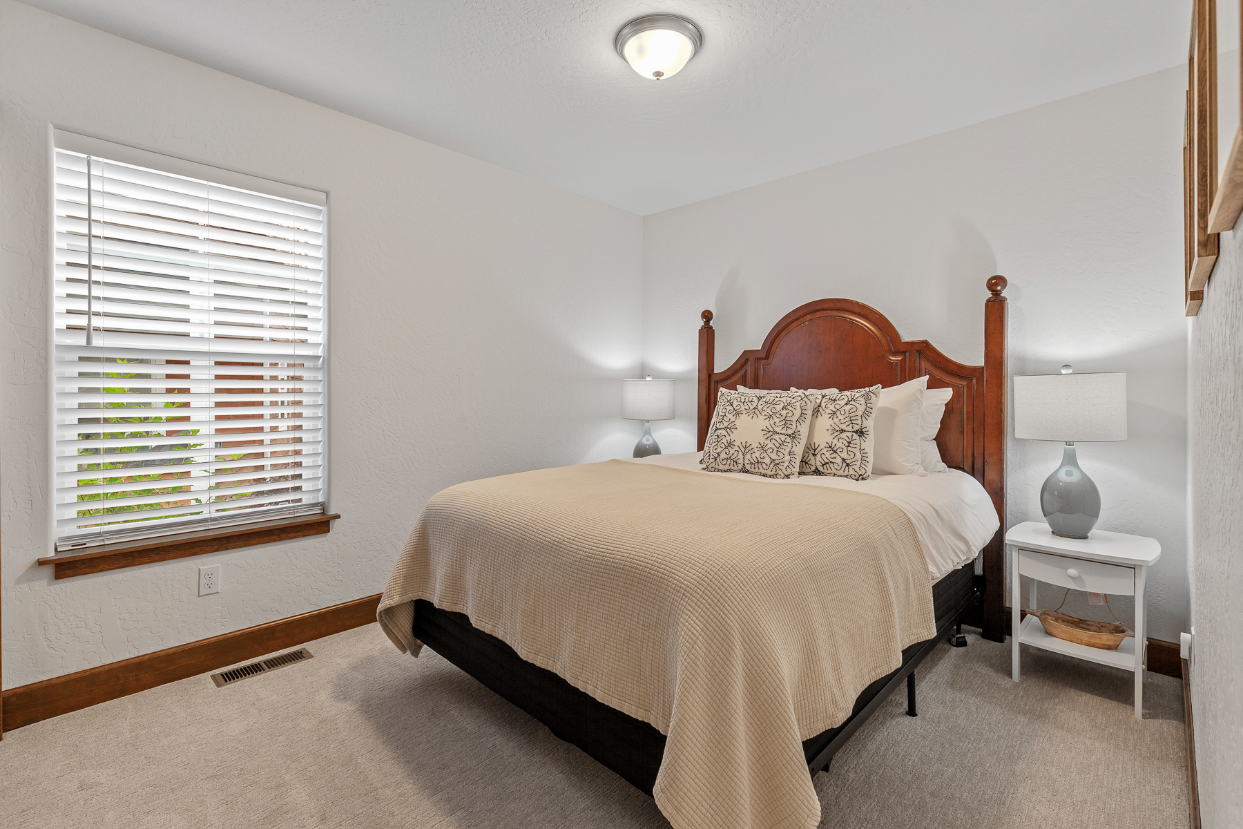 Relax and recharge in this cozy queen bedroom retreat.