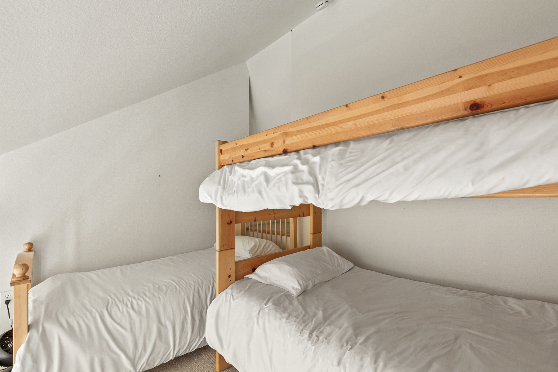 Guest Bedroom #2 loft with a twin-over-twin bunk bed + additional twin bed.