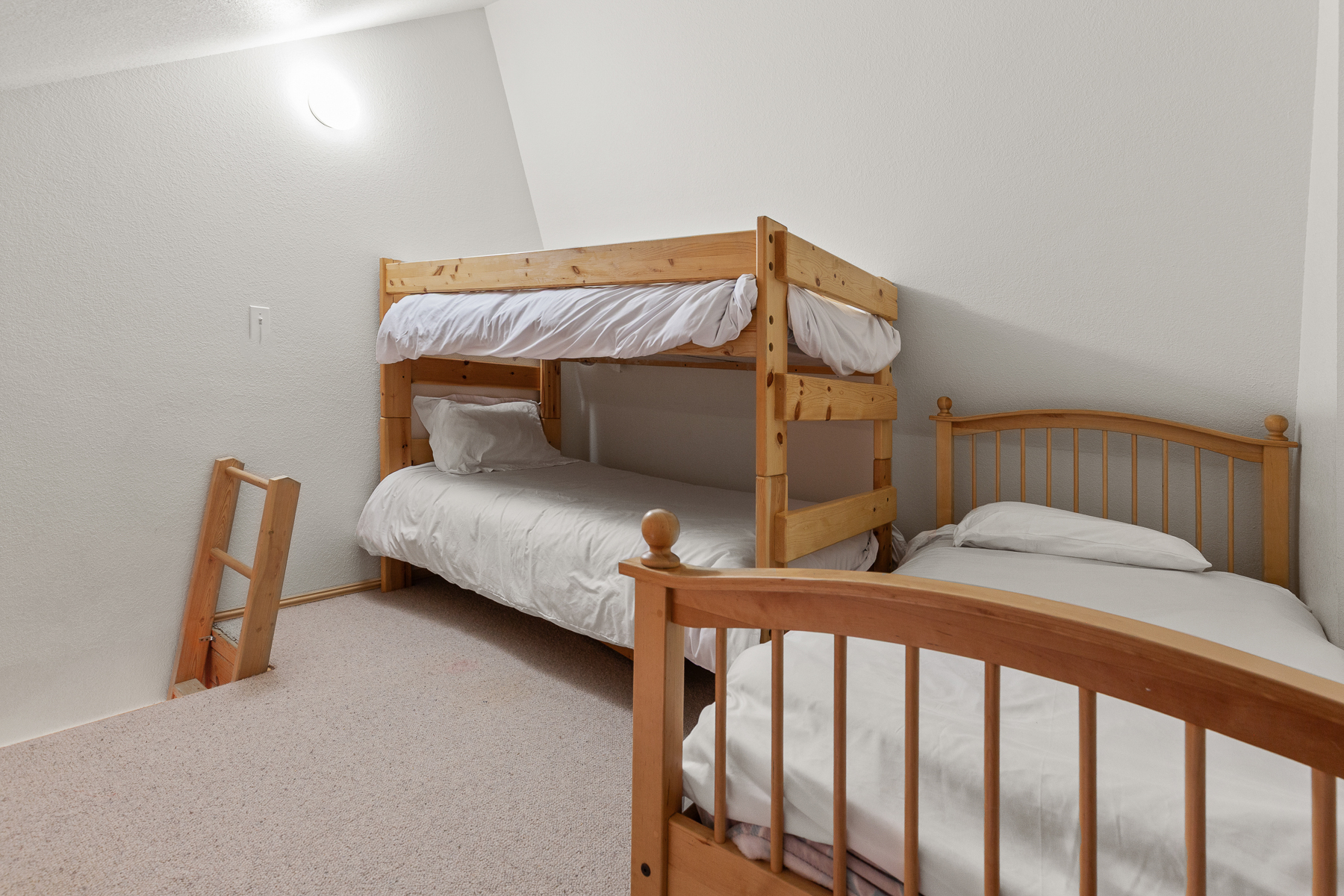 Guest Bedroom #1 loft with a twin-over-twin bunk bed + additional twin bed.