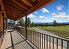 The covered wrap-around deck is the perfect spot to enjoy a drink while soaking in the views.