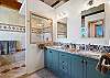 Main spa-inspired bathroom, complete with a whirlpool tub, large walk-in shower, and electric Japanese bidet toilet.