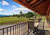 The covered wrap-around deck is the perfect spot to enjoy a drink while soaking in the views.