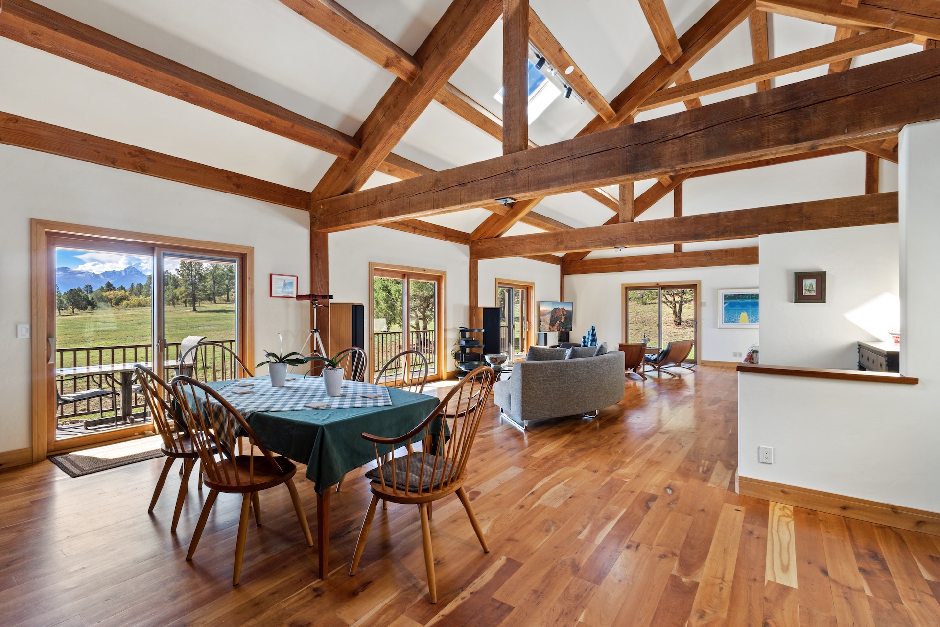 Open-concept living area with mountain views out every window. 