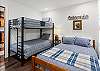 Guest bedroom with full bed and twin-over-twin bunk bed (lower level).