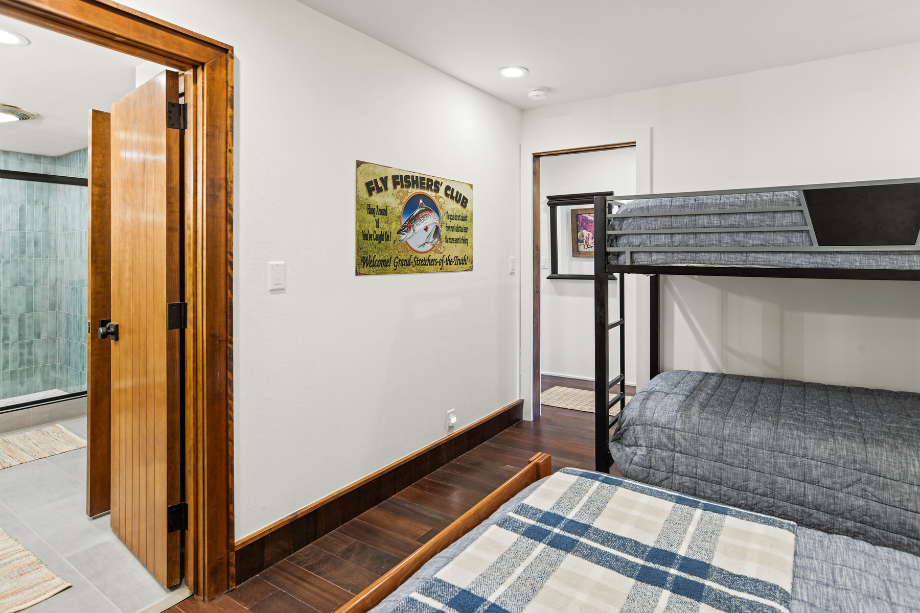 Guest bedroom with full bed and twin-over-twin bunk bed (lower level).