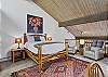 Main Queen bed with en suite bathroom (upper level).