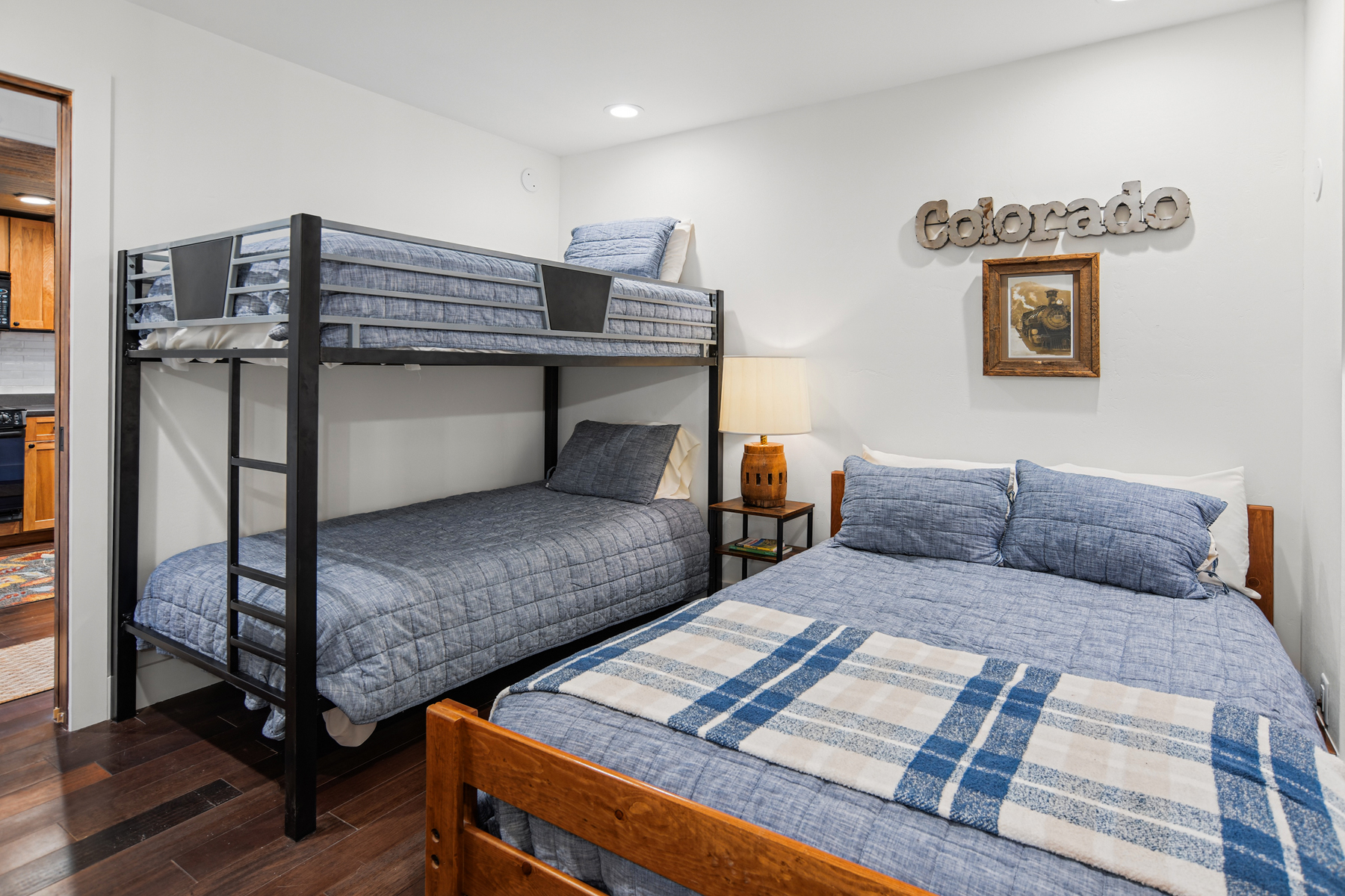 Guest bedroom with full bed and twin-over-twin bunk bed (lower level).