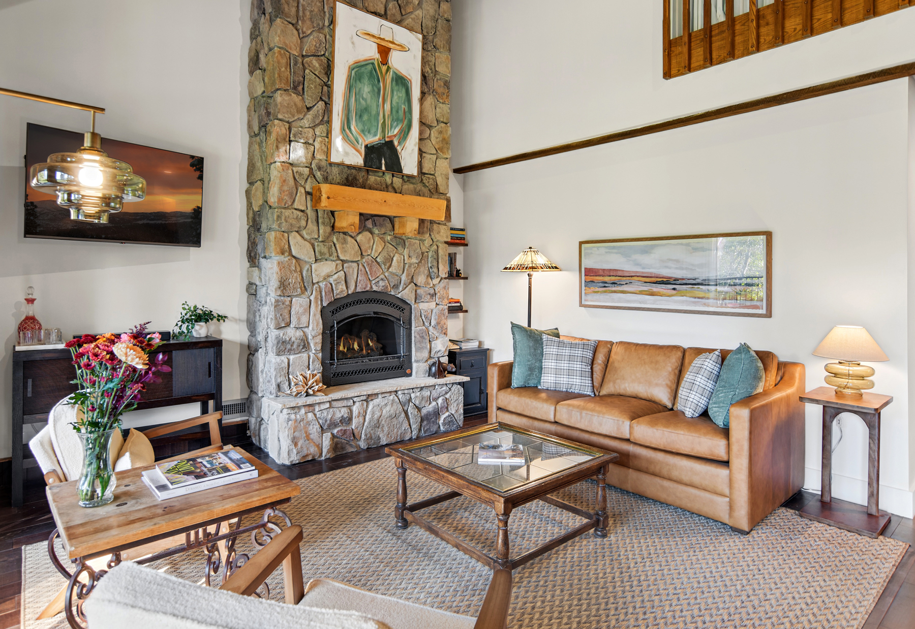 Comfortable living room with electric fireplace and smart TV.