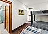 Guest bedroom with full bed and twin-over-twin bunk bed (lower level).