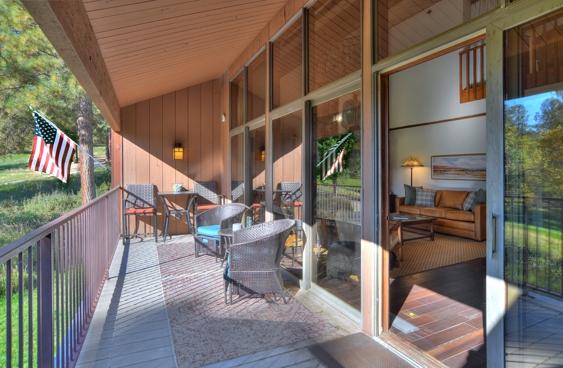 Deck with outdoor seating, electric Blackstone griddle, and golf course views.