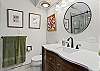 Main bathroom with makeup desk and walk-in shower (located upstairs)