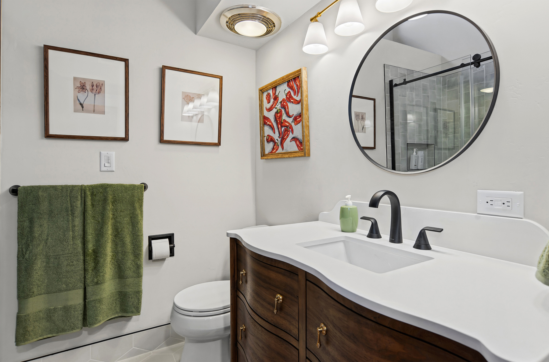 Main bathroom with makeup desk and walk-in shower (located upstairs)