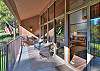 Deck with outdoor seating, electric Blackstone griddle, and golf course views.