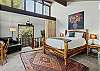 Main Queen bed with en suite bathroom (upper level).