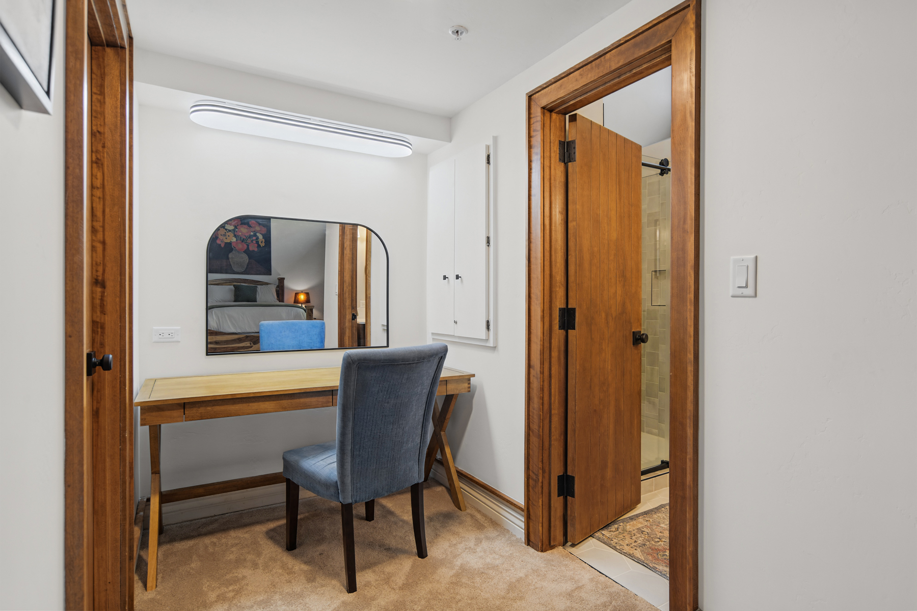 Main bathroom with makeup desk and walk-in shower (located upstairs)