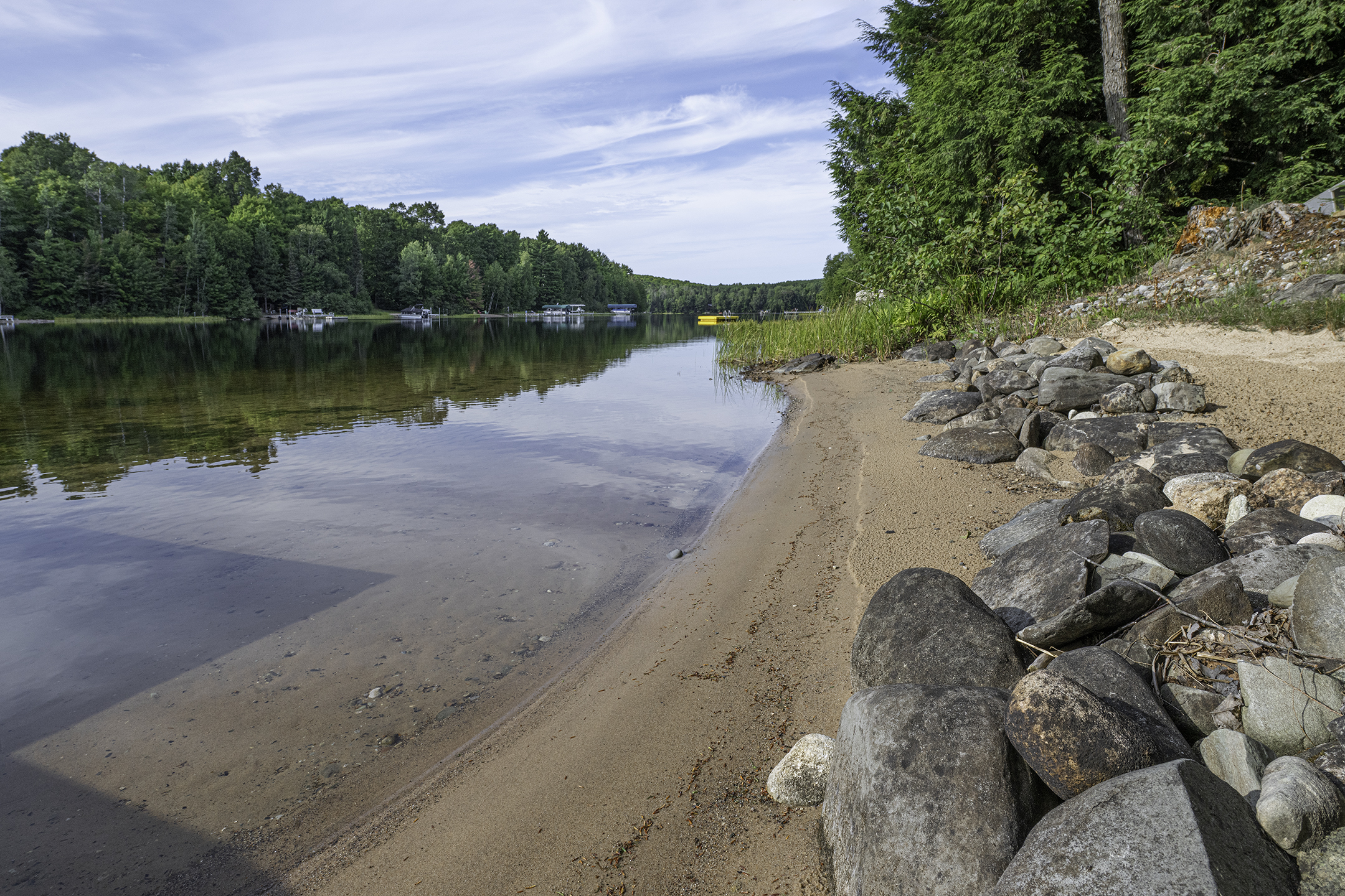 Private sandy beach with a gradual swim area