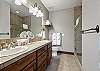 En suite bathroom with tiled walk-in shower.