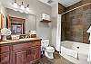 Guest bathroom with convenient shower/tub combo