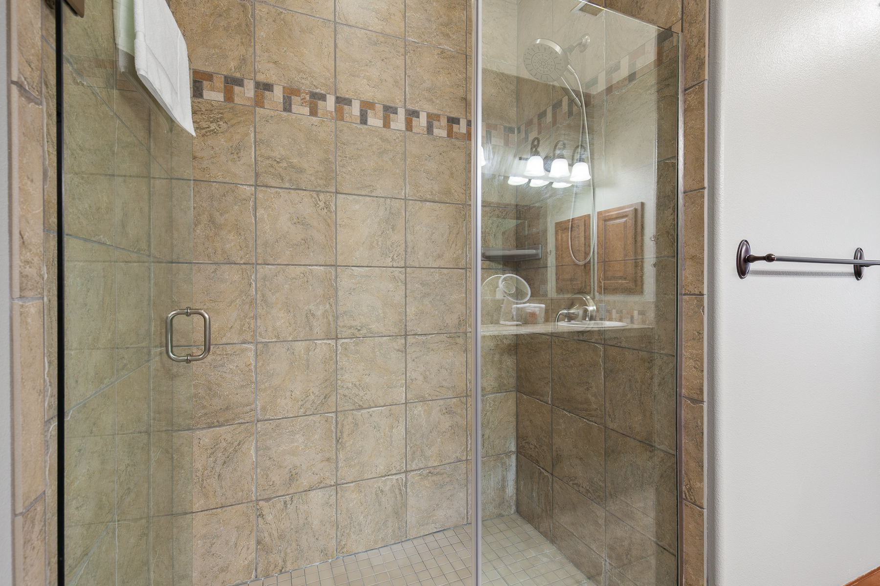 En suite bathroom with tiled walk-in shower.