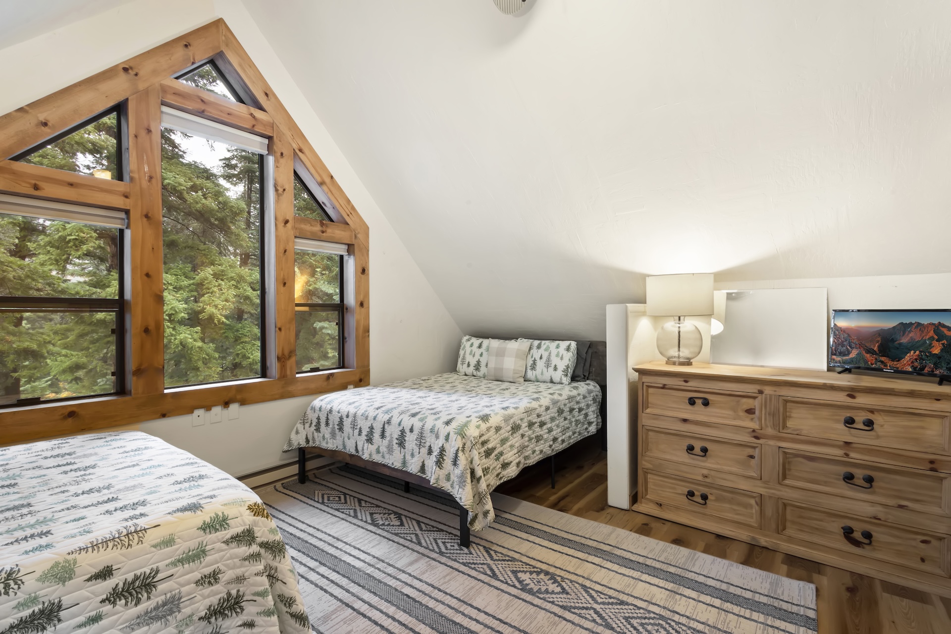 Bunk Room: 2 Queen Beds, a Twin XL Bunk Bed, and TV (3rd Floor)