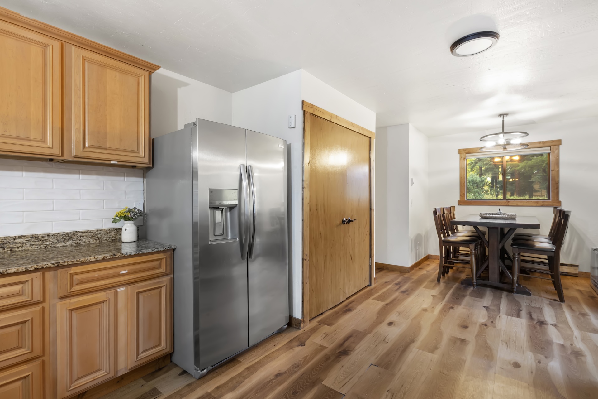 Open concept kitchen with a dining table for 6.