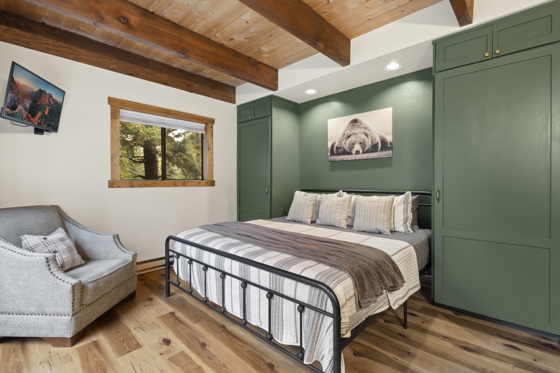 Primary Bedroom: King Bed, private vanity, TV, and sliding glass doors to a private deck (3rd Floor)