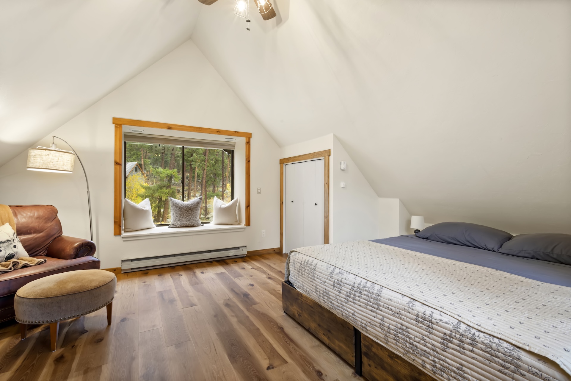 Loft Bedroom: King Bed, bay window, and oversized leather reading chair (4th Floor)